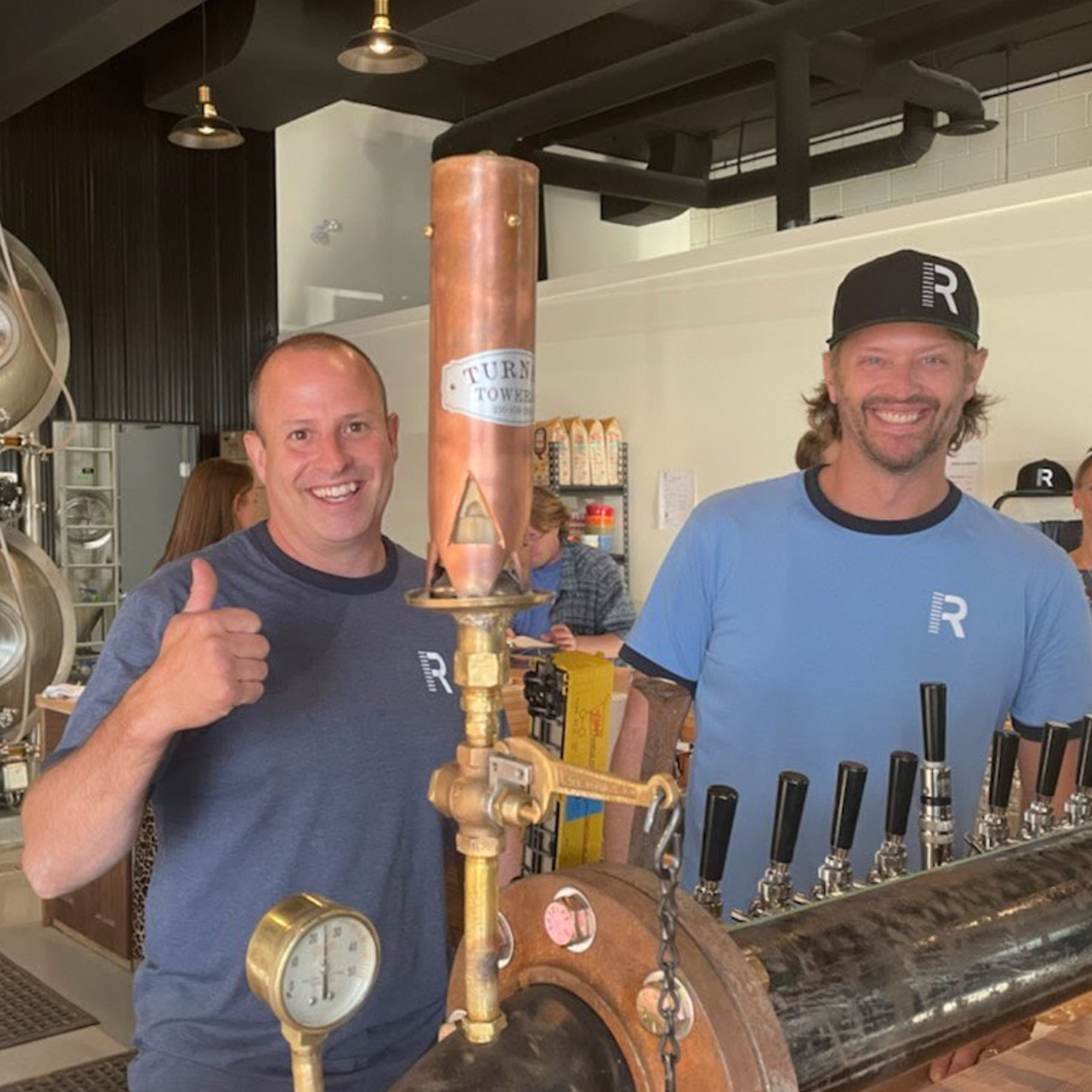 matt and rob behind the taps railside